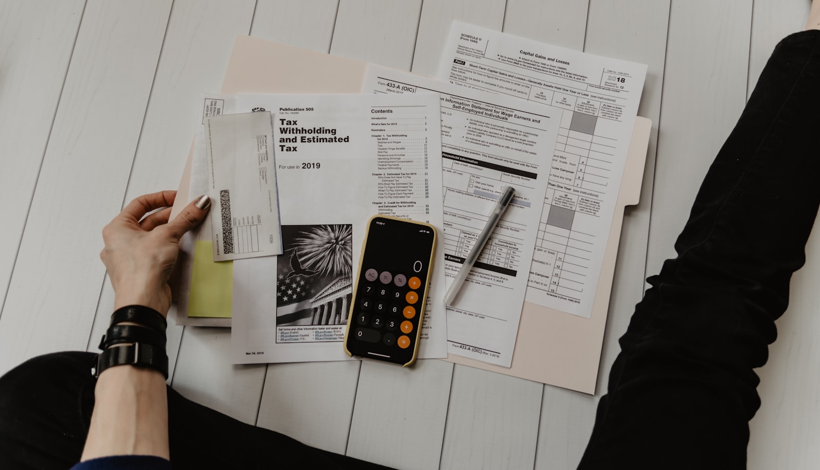 Investor reviewing municipal bond documents at a desk